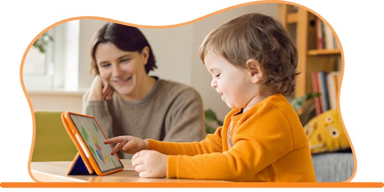 Online kindergarten tutor helps child learn on a tablet.