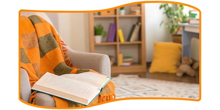 Child reading a book in cozy nook.